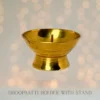 Traditional brass dhoopbatti stand for incense cone burning during puja rituals